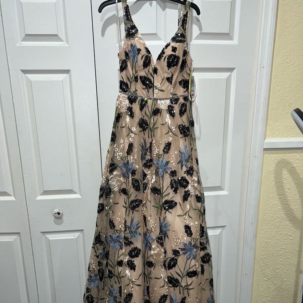 NEW WITH TAGS! Prom like dress. Never worn. Tulle at bottom